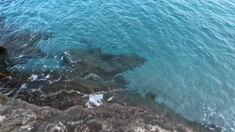 Top view off blue ocean waves crash coas... | Stock Video | Pond5