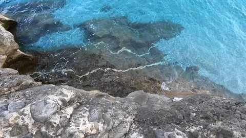 Top view off blue ocean waves crash coastline cliff Stock Footage 104921941