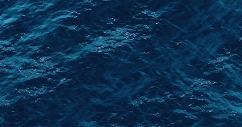 Top of view of blue sea ocean waves water movement background in sunny day Stock Footage 77624965