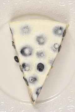 Top View of Blueberry Cake Slice with Vanilla Cream Stock Photos