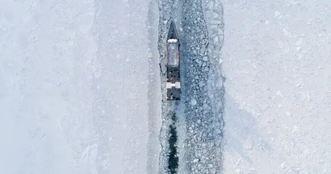 Top View Boat Float on the Surface of a Frozen Lake Baikal. Travel Concept Stock Footage 123403115