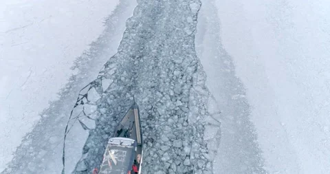 Top View Boat Float on the Surface of a Frozen Lake Baikal. Travel Concept Video stock 130785643