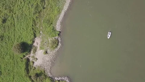 Top View of Boat Passing By, Riverside Video stock 78749822