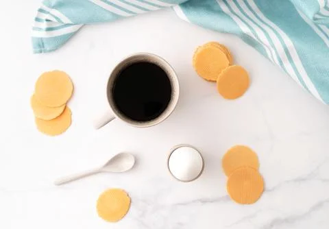 Top view of boiled egg in ceramic egg cup, cup of coffee and thin crispy corn Stock Photos