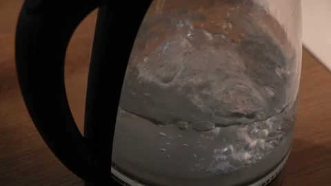 Top view of boiling water in electric glass kettle in kitchen Stock Footage 312278523