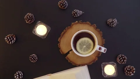 Top view  the book on the table with tea and candles Stock Footage 70007347
