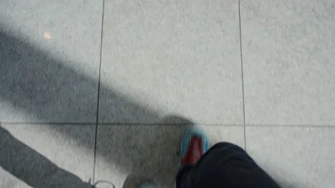 Top view boots walk on tile indoors floor Stock Footage 132046965