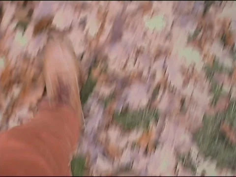 Top view of boots walking through leaves Stock-Footage 133804303