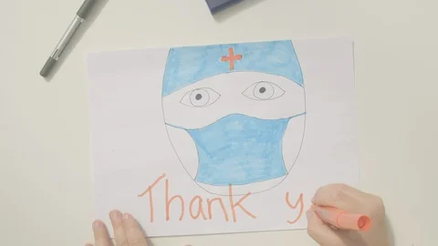 Top view of a boy drawing an image thanking doctor Video stock 129043606