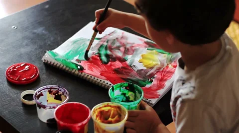 Top view of boy draws paints abstract drawing Vídeo Stock 28298301