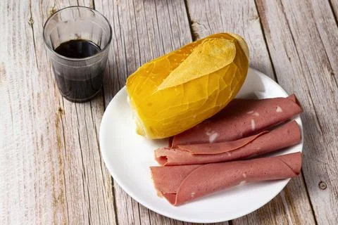 Top view of Bread and slices of mortadella on the wooden table Stock Photos