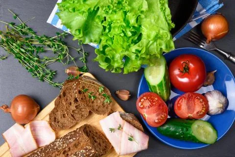 Top view: bread with bacon. Ingredients. Vegetables Stock Photos