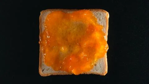 TOP VIEW: Bread with an orange jam Stock Photos