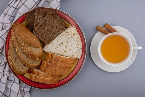 Top view of breads as sliced seeded brown cob rye baguette and flatbread in.. Stock Photos