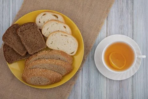 Top view of breads as sliced seeded brown cob rye white ones in plate on sa.. Stock Photos