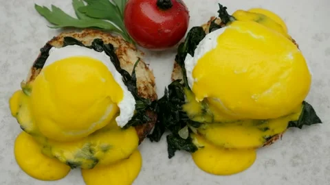 Top view of breakfast with eggs Benedict, toasted muffins, hollandaise sauce Stock-Footage 163515804