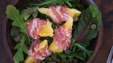 Top view of breakfast with poached egg and toast bread, salad with arugula Stock Footage 124795974
