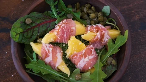 Top view of breakfast with poached egg and toast bread, salad with arugula Stock Footage 124796102