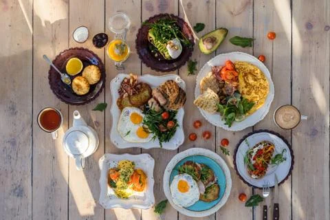 Top view of the Breakfast table with various dishes Stock Photos