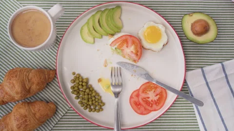 Top view Breakfast table, woman's hands take Cup of coffee with croissant. Home Video stock 138086869