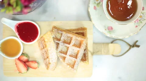 Top view breakfast waffles and hot tea from above Stock Footage 51764461