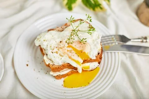 Top view Breakfast on white bed sheets, good morning, toast with poached eggs Stock Photos