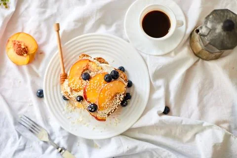 Top view Breakfast on white bed sheets, good morning, summer french toast Stock Photos