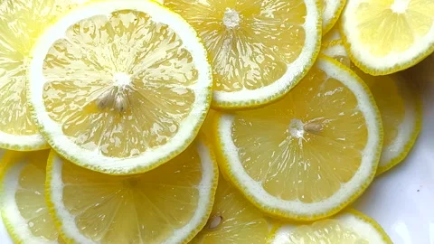 Top view of bright yellow sour lemon slices Video stock 308468537