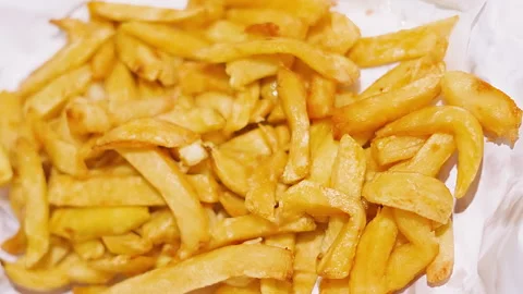 Top View of British Chips in White Paper. Stock Footage 321797705