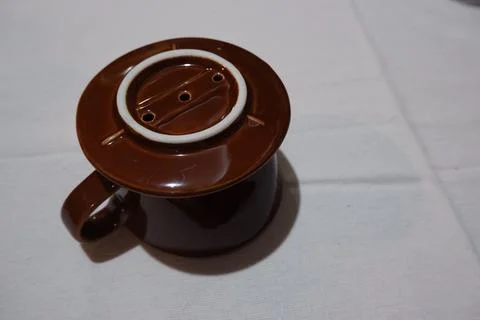 Top View of Brown Ceramic V60 Pour Over Dripper on Matching Coffee Mug Stock Photos