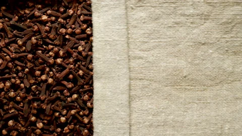 TOP VIEW: Brown cloves under opening sackcloth Stock Footage 171149424
