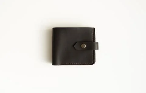Top view of brown empty man's black handmade genuine leather wallet for Stock Photos