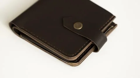 Top view of brown empty man's black handmade genuine leather wallet for Stock Photos