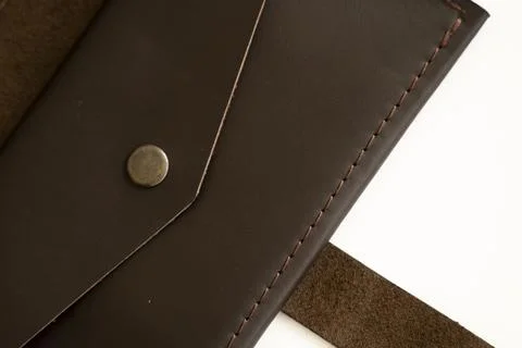 Top view of brown empty man's black handmade genuine leather wallet for Stock Photos