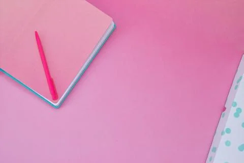 Top view brown pink notebook on pink pastel color background. Stock Photos