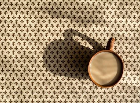 Top view of a brown tablecloth on which there is a pattern Stock Photos