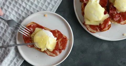 Top view of bruschetta with parma ham and Egg Benedict. Classic Eggs Benedict Stock Footage 126497549