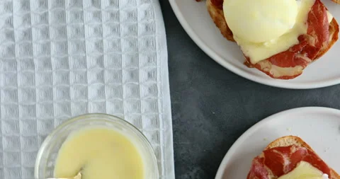 Top view of bruschetta with parma ham and Egg Benedict. Classic Eggs Benedict Stock Footage 126497550