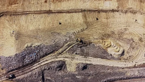 Top view of a bulldozer working on a massive garbage dump Vídeos de archivo 338187796