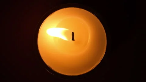 Top view on Burning candle close up on a dark background. Slow motion full HD Stock Footage 160004380