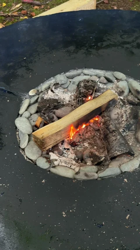 Top View of Burning Firewood in Round Outdoor Fire Pit Видео 342166361