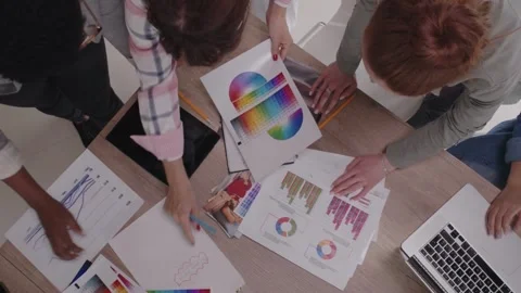 Top view of Business people developing a business project and analyzing market Stock Footage 334654327