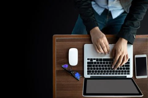 Top view of a businessman using his work computer on a desk Stock Photos