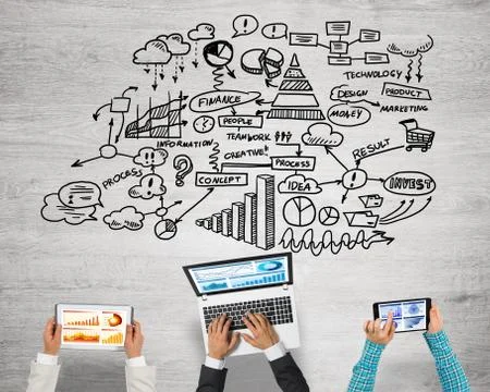 Top view of businesspeople sitting at table and using gadgets Stock Photos