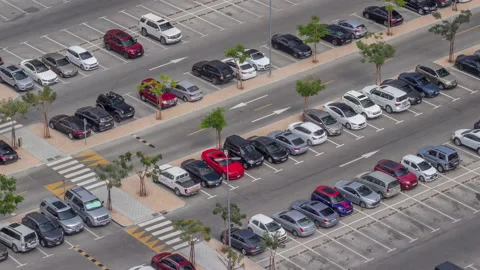 Top view busy parking lot with many cars moving in and out timelapse. Stock Footage 186551603