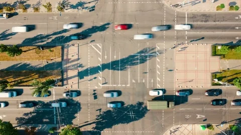 Top view of a busy regulated intersection in the city, time lapse of a road Stock Footage 199506435