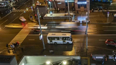 Top view of a busy square with crowds, crosswalks, heavy traffic and bus term Stock Footage 154426313