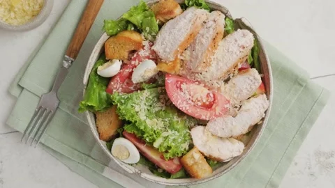 Top view of Caesar salad in a plate with fork. Healthy salad Stock Footage 220480182