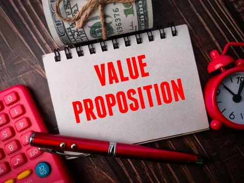 Top view calculator,clock,pen,banknotes and notebook with text VALUE PROPOSITION Stock Photos