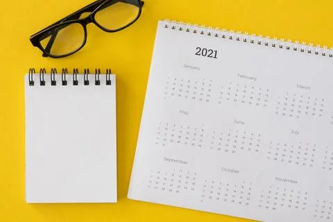 Top view calendar with notepad glasses Stock Photos